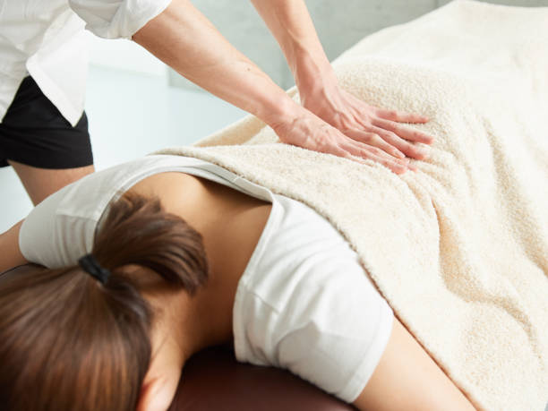 Japanese woman receiving a waist massage